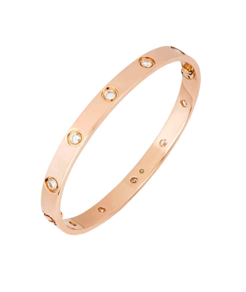Rose gold bracelet with small diamonds on a white background