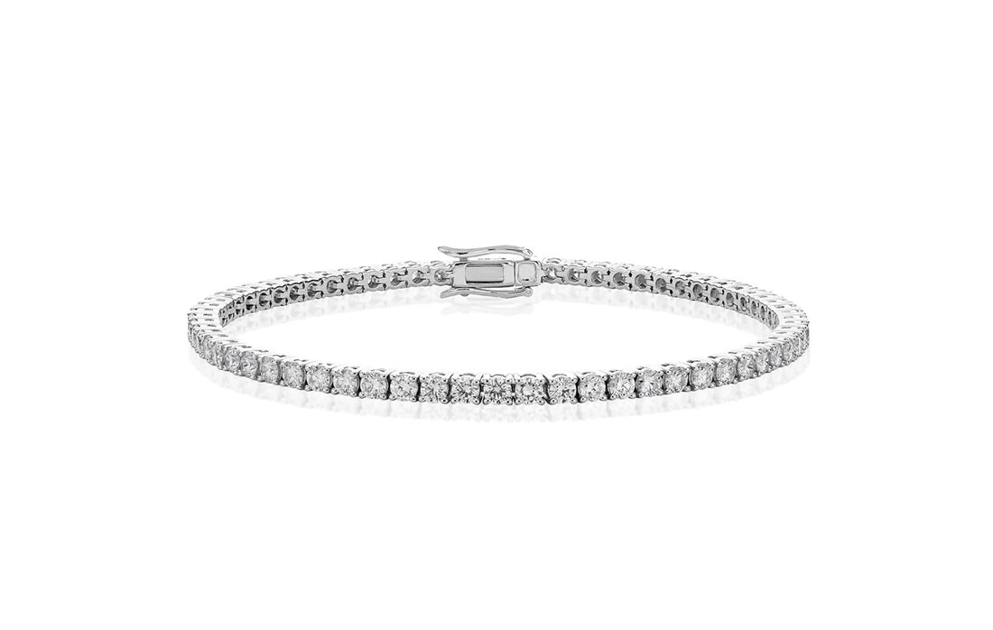 Silver bracelet with clear stones on a white background